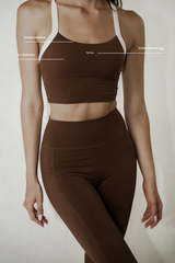 Model wearing buttery soft crop top with adjustable straps and in-built bra, showcasing a comfortable fit and versatile design for all-day support.