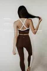Model wearing buttery soft crop top with adjustable straps and in-built bra, showcasing a comfortable fit and versatile design for all-day support.