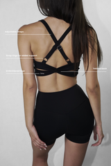 Model wearing Original Sports Bra with sculpting support and second-skin feel, crafted from 80% recycled nylon for a sustainable and comfortable fit during workouts.